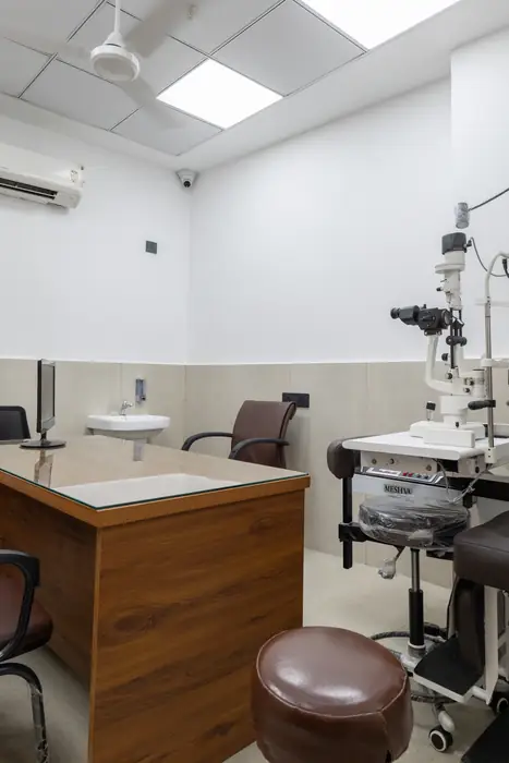 Doctor's consultation room with a slit-lamp microscope